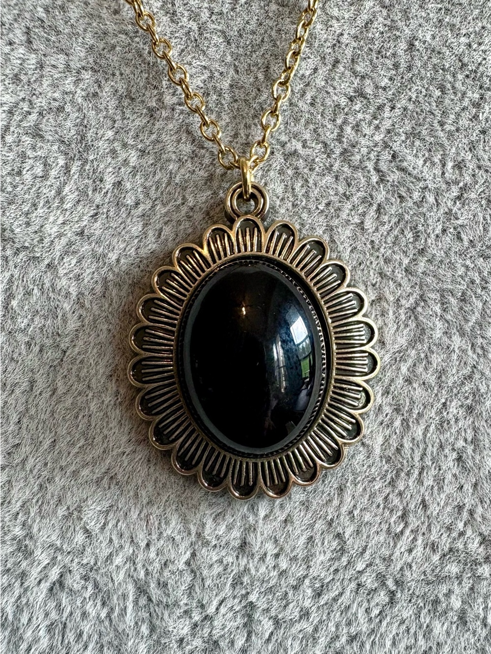 Gold-Tone Flower Necklace with Black Oval Pendant
